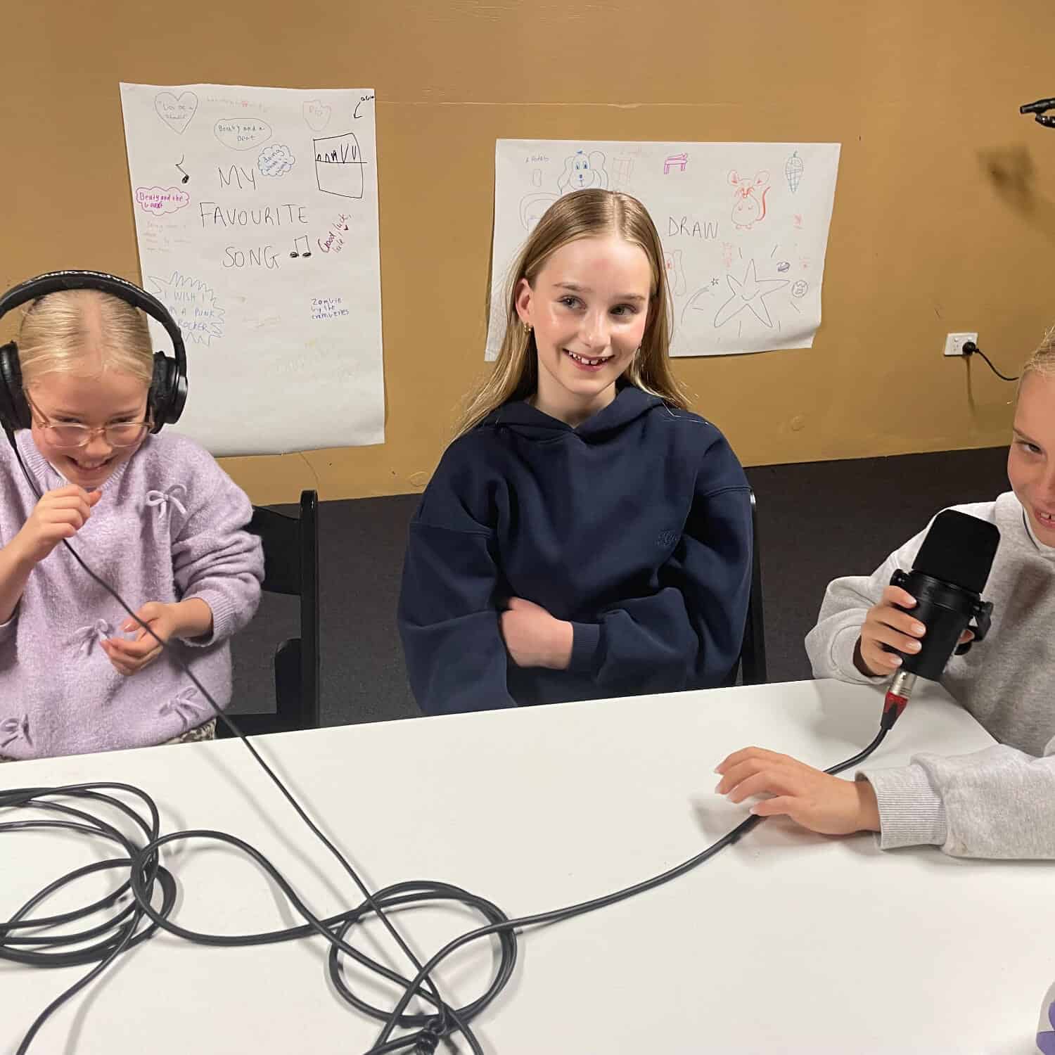Young girls recording a podcast at Westsider Radio studio during Symphony of Stories 6.